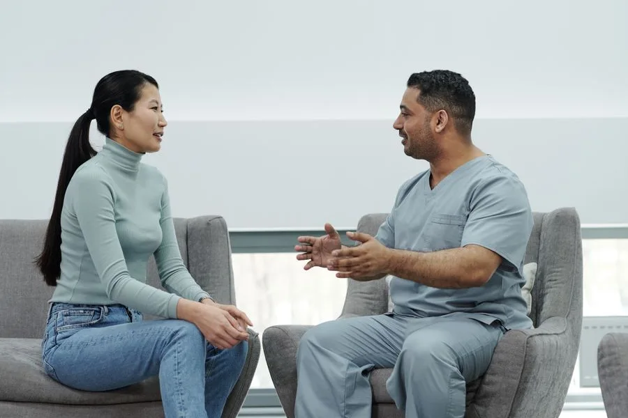A patient talking with a healthcare provider