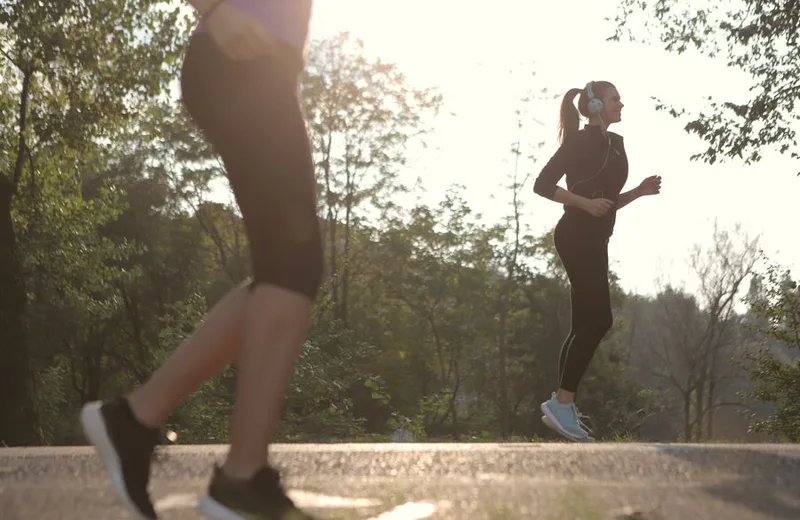 Woman taking a gentle walk outdoors on a sunny path